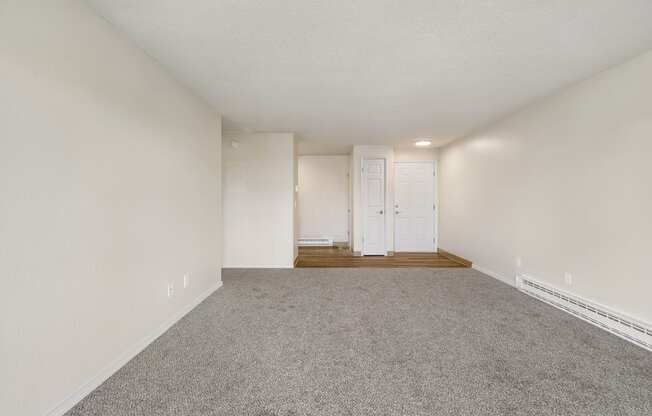 a spacious living room with white walls and carpet at Wildflower, Washington, 99336