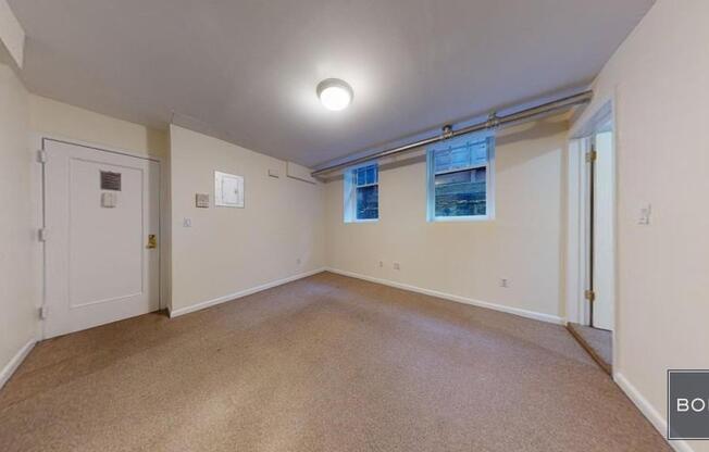 207 209 W 11 ST