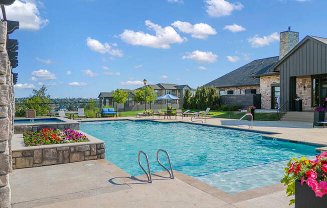 a swimming pool with a house in the background