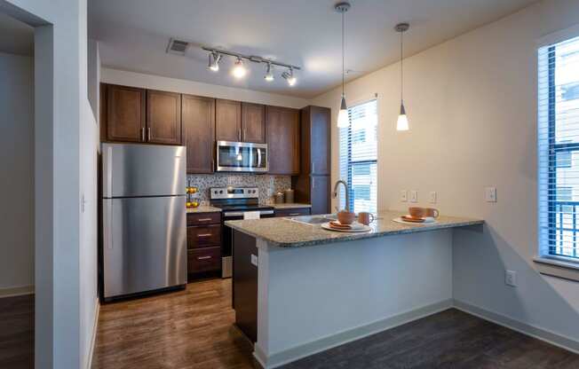 Spacious kitchen with breakfast bar and stainless appliances  at Artisan on 18th, Tennessee