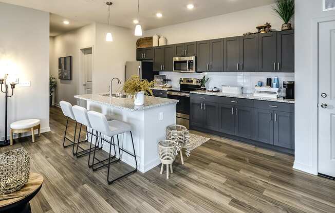 Two and three bedroom townhomes featuring golf course views, fill-size washer and dryer, stainless steel appliances, granite countertops, kitchen island, faux wood flooring and smart-home technology with keyless entry at Sandstone Villas in Omaha, NE