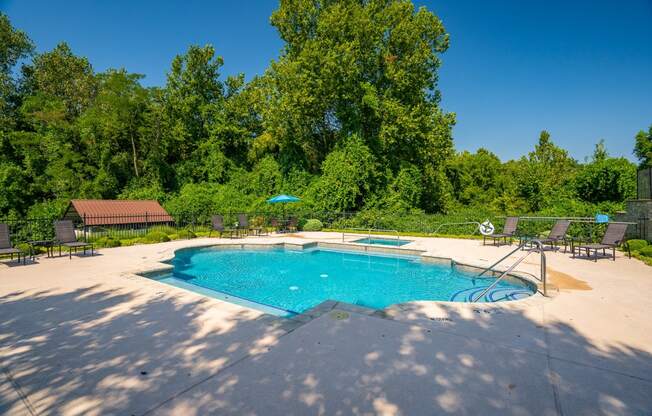 Spacious Pool Sundeck Surrounded By Lush Trees & Landscaping