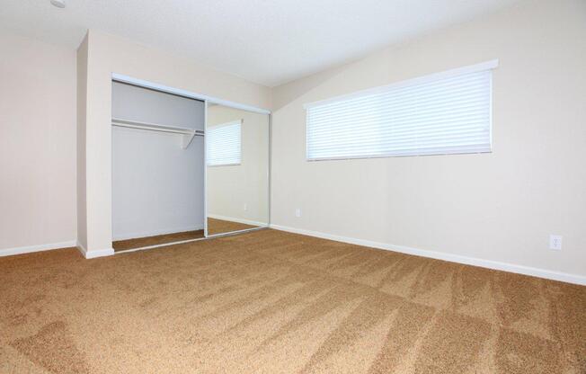 a bedroom with a bed in a room