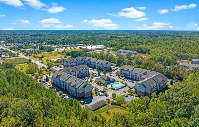 a aerial view of a building complex surrounded by trees
