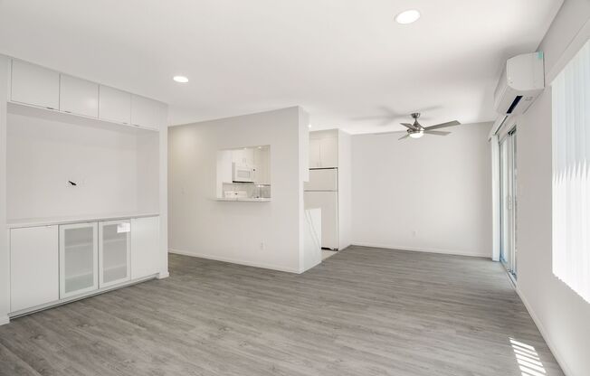 One of Kind 2/2 ! GARAGE with EV Charger  + Add Parking, AC, WD in unit  Walk to BEACH and BAY. Private Patio