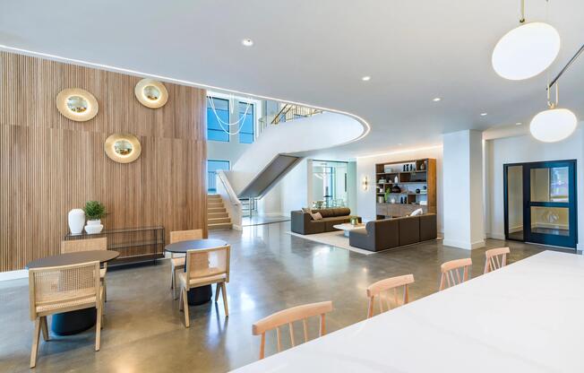 A welcoming lobby with layered seating, warm finishes, and space to gather, work, or unwind throughout the day.