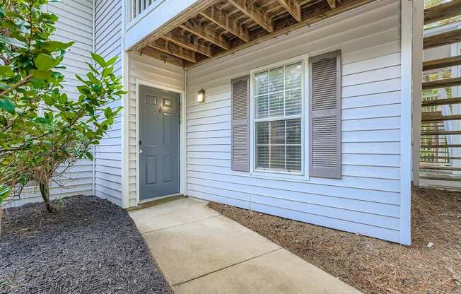 A house with a grey door and window.