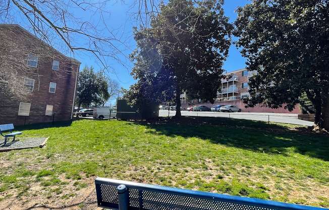 a park bench in front of a building at Barracks West in Charlottesville, VA