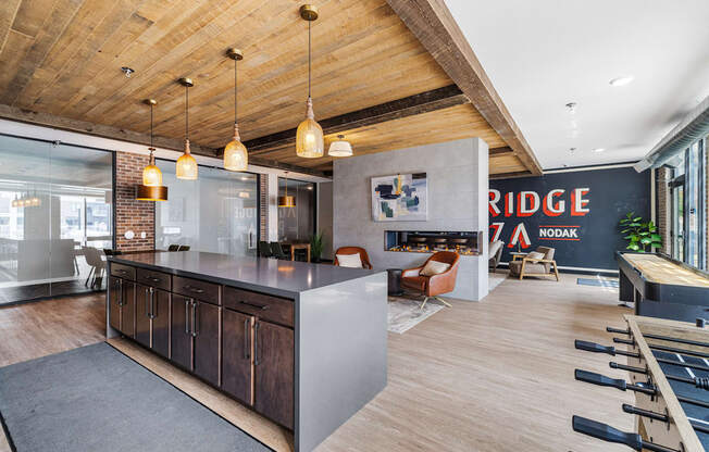 a kitchen with a large island in the middle of a room with a living room at EagleRidge Plaza Residences, North Dakota, 58104