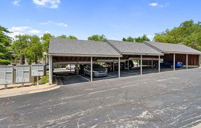 a parking lot with cars in front of a building