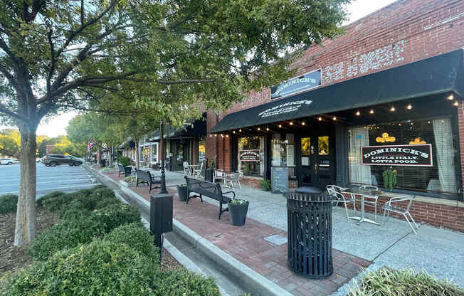 A street view of a city with a restaurant named Positano's.