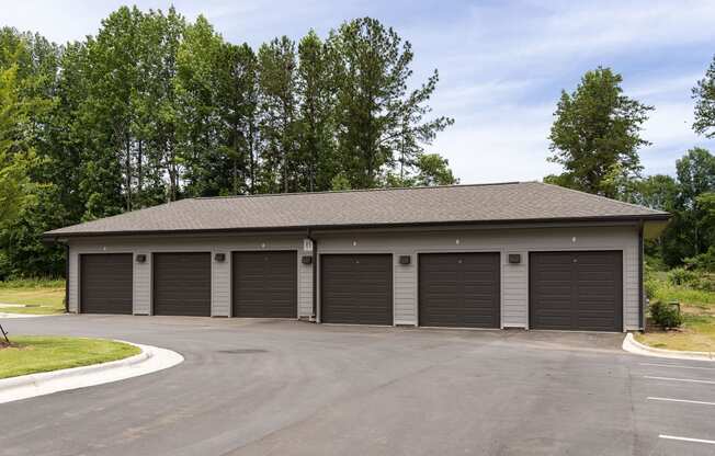 a garage with three roll up garage doors
