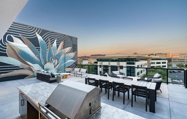 The rooftop lounge at Modera Kierland offers sweeping desert views, a built-in grill station, and plenty of space to gather and unwind under the open sky.