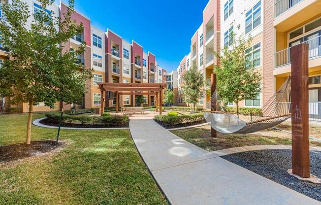 outdoor hammock lounging area at Aspire at 610 apartments