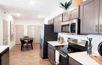 a kitchen and dining area in a 555 waverly unit