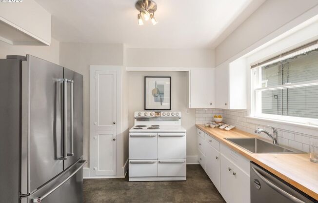 Charming 2-Bedroom Gem with Spacious Living Room with Fireplace + Bright Open Kitchen