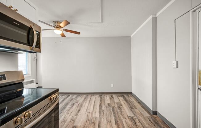 the renovated kitchen and living room in a new home