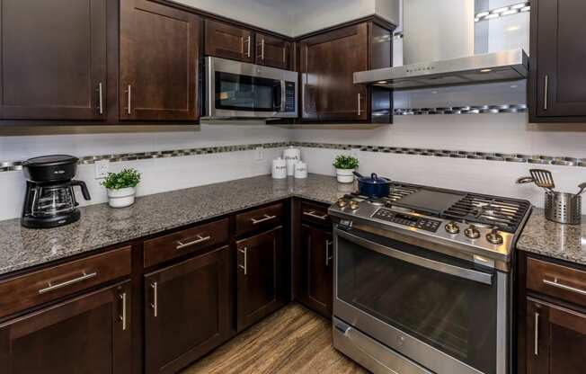 Kitchen with wooden cabinets at Level 25 at Sunset by Picerne, Nevada
