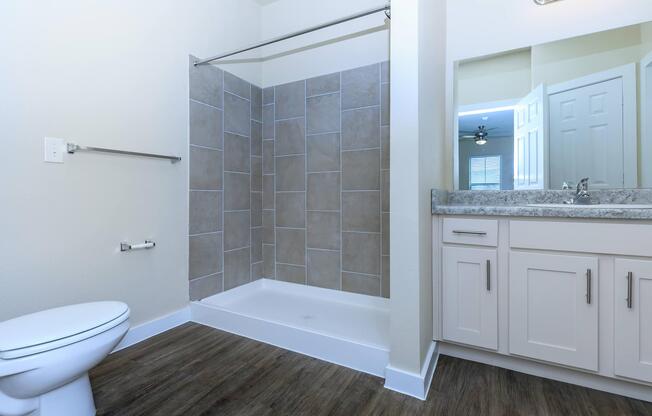 Apartments in Leander TX - Hills at Leander Expansive Bathroom with a Large Vanity, Shower, and Much More