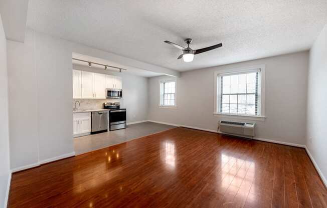 Gorgeous Hardwood Floor in Living Room Leading to Kitchen at Connecticut Plaza Apartments, 2901 Connecticut Ave NW, Washington, DC, 20008.