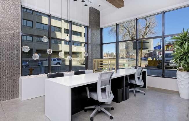 White conference table with chairs in Civic Lofts lobby