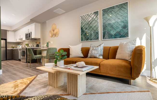 Apartments for Rent in Downtown Los Angeles, CA - The Emerald - Living Room with Floor-to-Ceiling Window, Abstract Coffee Table, and Luxury Plank Flooring