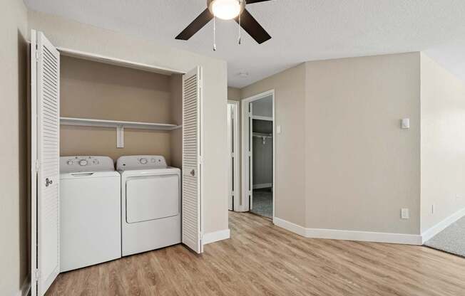 A laundry room with a washer and dryer in it.