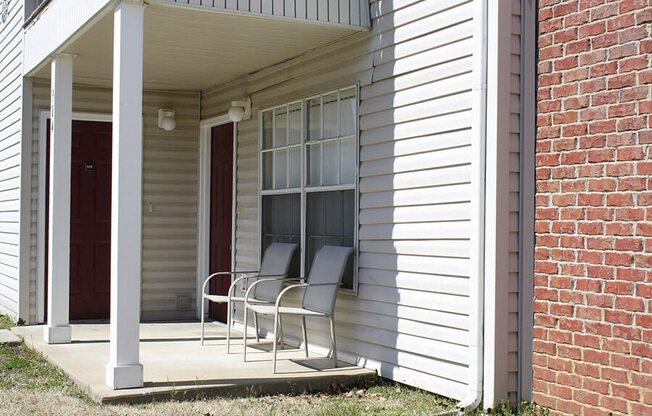 Apartment patio with chairs at Cobblestone Corners Apartment Homes, Nashville, TN