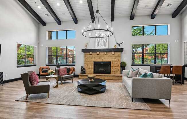 A living room with a fireplace and a chandelier.