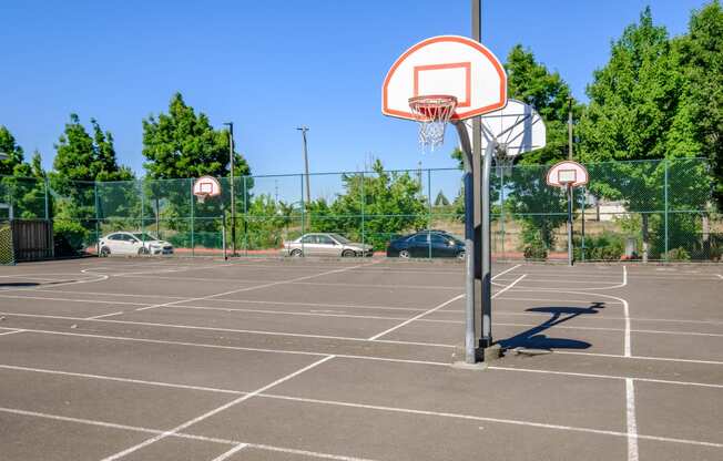 a basketball hoop in a parking lot