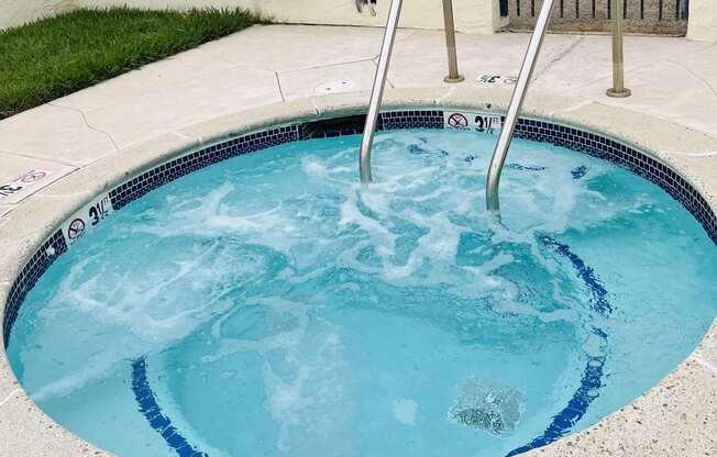 Inviting clear spa in private area at Plaza Verde Apartments in Escondido, California.