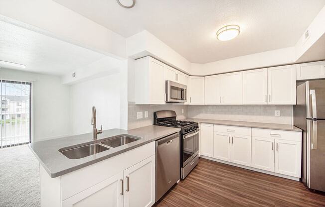Renovated Kitchen with Subway Tile Backsplash at The Crossings Apartments, Grand Rapids, Michigan