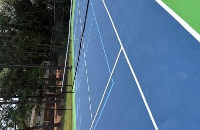 A blue running track with white lines.