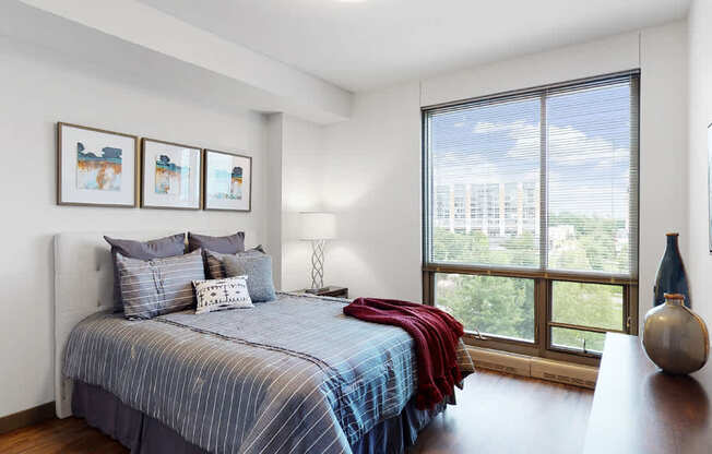 Spacious bedroom with floor-to-ceiling windows a 1 bedroom floor plan Midtown Crossing Apartments Omaha