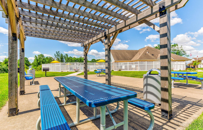 a picnic area with a table and benches