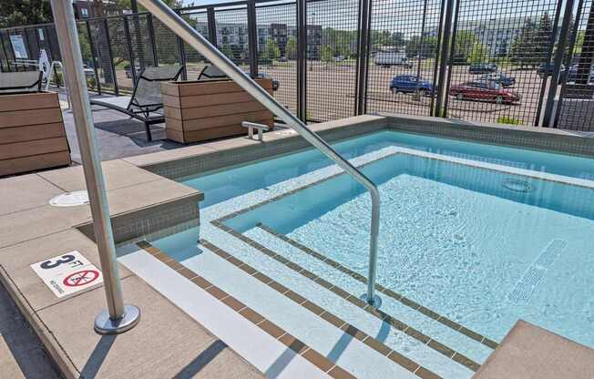 A pool with a no swimming sign on the floor.