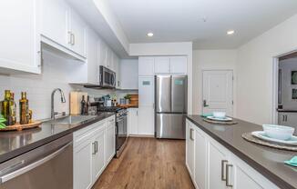 a large kitchen with stainless steel appliances
