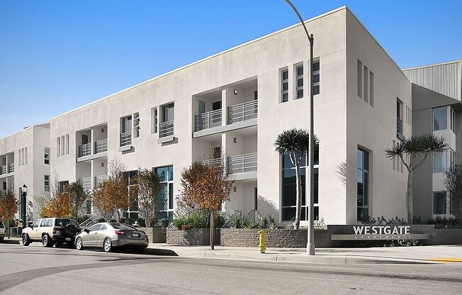 a white building with a street light in front of it