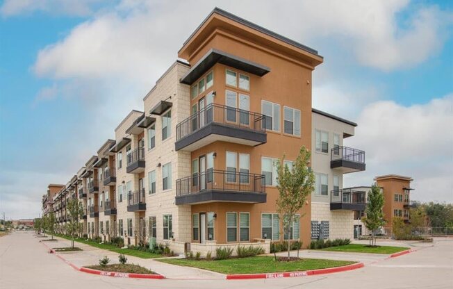 a row of apartment buildings with balconies