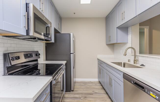 a stove top oven sitting inside of a kitchen