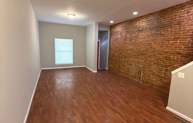 Charming Baltimore Rowhome with Private Deck & Exposed Brick