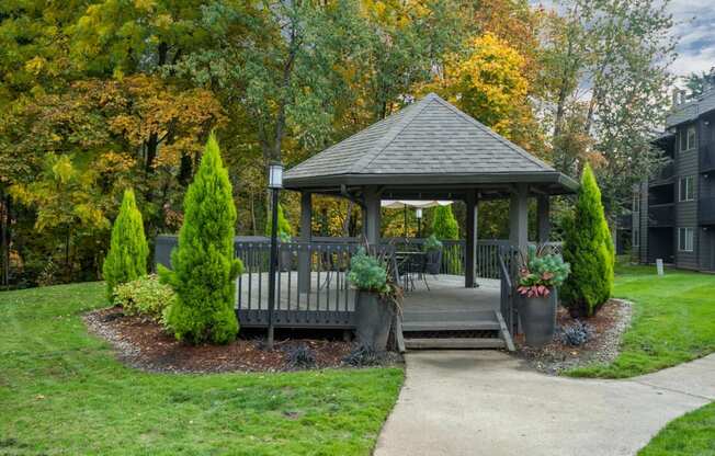 a gazebo in the middle of a yard