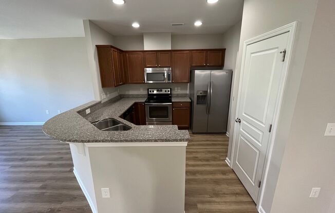 Corner Unit 3BD, 2.5BA Townhouse in North Raleigh with 1-Car Garage and Premier HOA Amenities