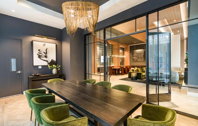 Layered textures, statement lighting, and tailored finishes create a conference room designed for focused meetings and elevated collaboration.