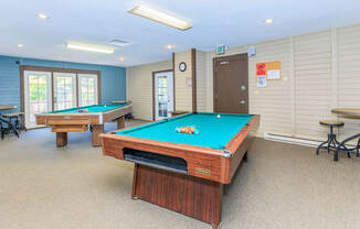 a game room with two pool tables and two billiards at Lincoln Village Apartments, Spokane, WA