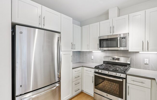 Kitchen with white cabinetry at Park77 Apartments, Massachusetts, 02138