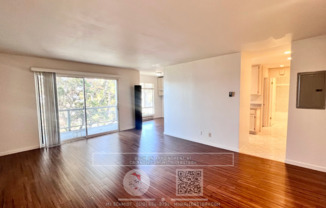 Beautiful large 1 bedroom with Hardwood laminate floors, parking and water view!