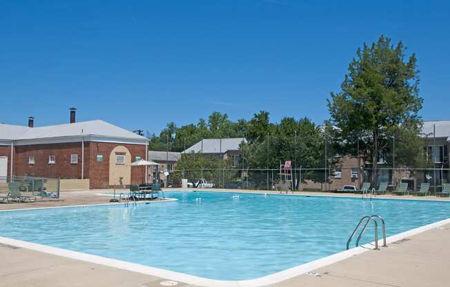 a swimming pool with a building in the background