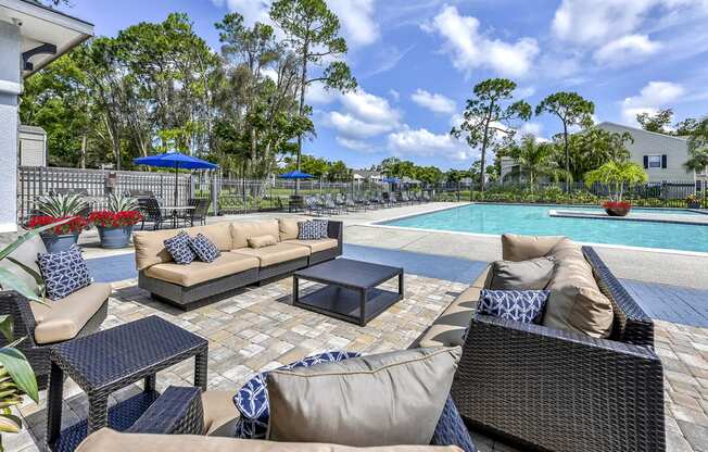 Swimming Pool and Outdoor Lounge at Brantley Pines Apartments in Ft. Myers, FL