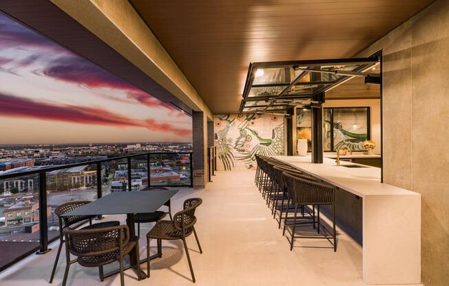 Rooftop bar seating with skyline views, offering a relaxed setting for evenings and gatherings at Modera St. Paul.
